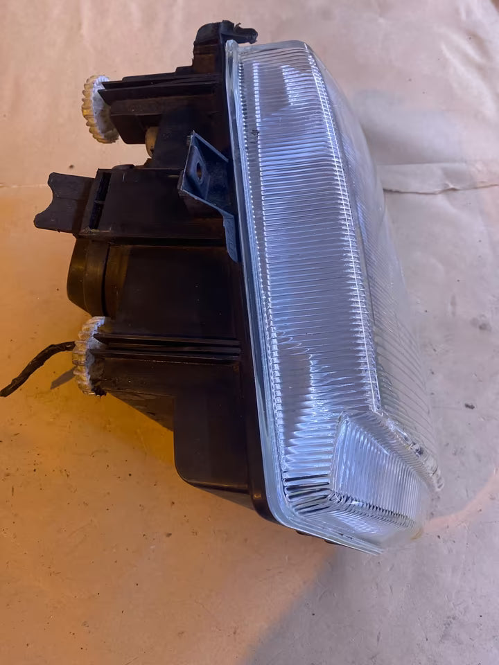 VW Caddy Scheinwerfer links 085818